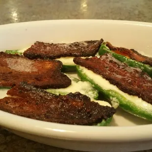 Jalapeño poppers with bacon strip appetizer