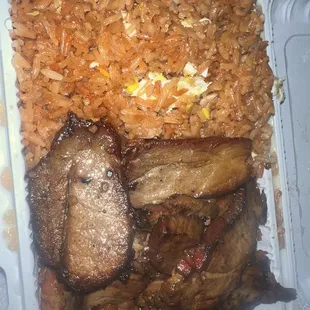 meat and rice in a styrofoam container
