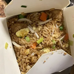 rice and vegetables in a take out box