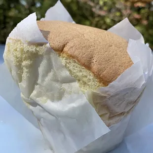 a half eaten sandwich on a wrapper