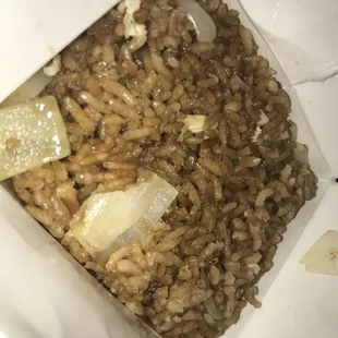a bowl of brown rice and onions