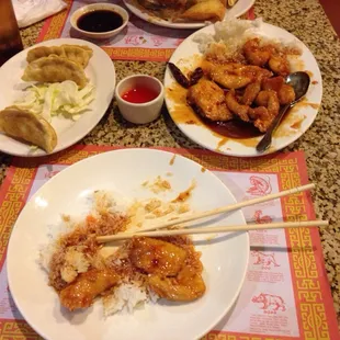 Orange chicken dinner with a side of pot stickers