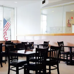 empty tables and chairs in a restaurant