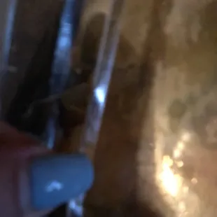 The lid is busted so sauce spilled everywhere