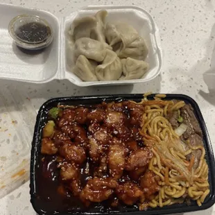 a tray of noodles and dumplings