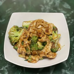 a plate of stir fried broccoli