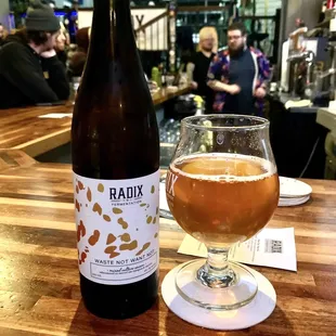 a bottle and a glass of beer