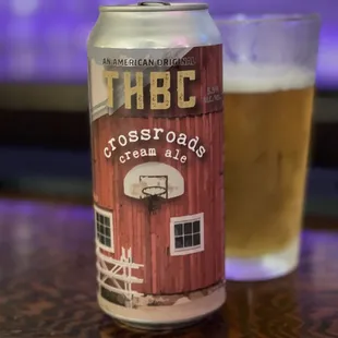 a can and a glass of beer