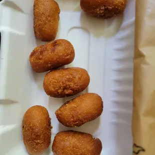 the doughnuts in a styrofoam container