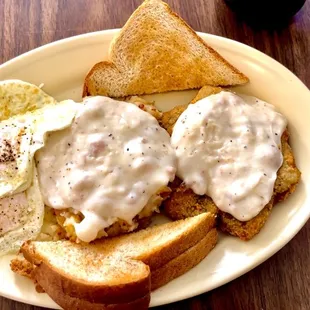 2 eggs over easy, fried potatoes with gravy, country fried steak with gravy and toast $8 !