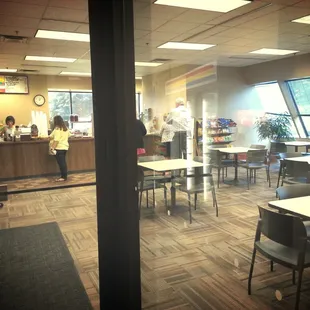 people eating at tables in a restaurant