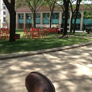 a person&apos;s feet on the sidewalk