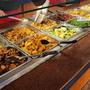 a buffet with a variety of food items