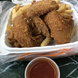 Fried chicken wings, French fries with mambo sauce