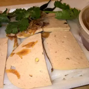 Bahn cuon nong... Rice noodle filled with pork and woodear mushroom topped with pork meat loaf