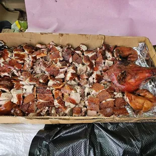 After... the suckling pig (50 pounds) was chopped and is ready to serve. It fits in the back of a Honda CRV.