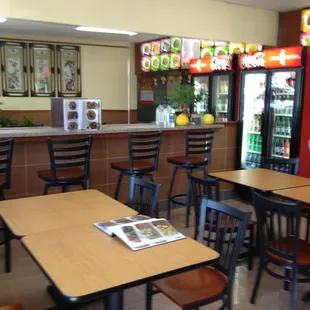 empty tables and chairs in a restaurant