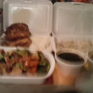 Roast pork egg foo young and sauce with white rice, Hunan chicken with white rice, and 8 steamed dumplings with dip.