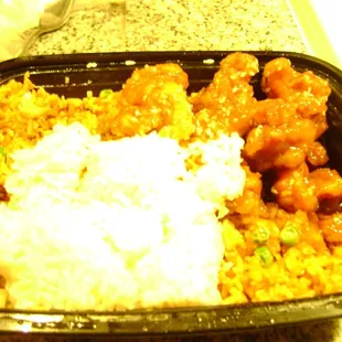 rice, meat, and vegetables in a plastic container