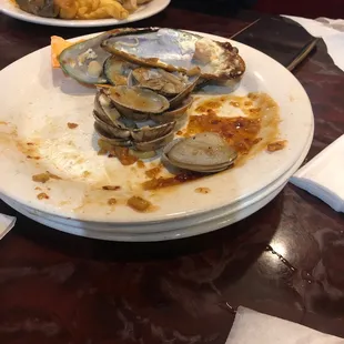 a plate of clams on a table