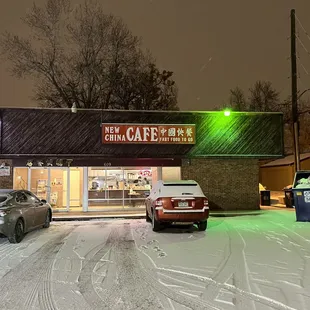 cars parked outside in the snow