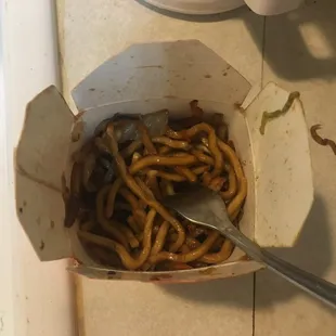 a box of pretzels with a spoon in it