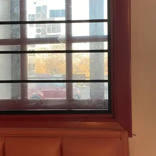 Dirty interior glass that looks like it has not be cleaned since 1945.