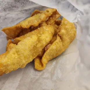fried fish sticks in a paper bag