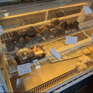 a display case filled with donuts