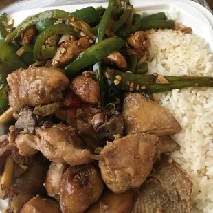 lunch bento with two sides, includes chicken, mushrooms, among others