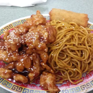 a plate of food with noodles and meat