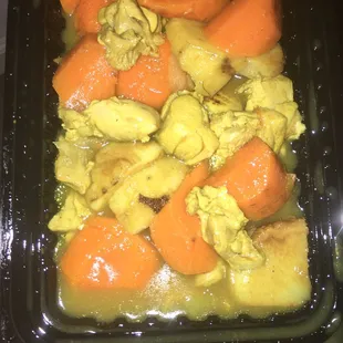 chicken, carrots, and potatoes in a sauce