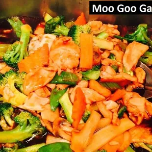 a stir fry with broccoli and carrots