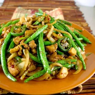 a plate of stir fried green beans