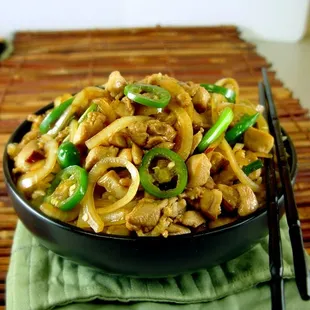 a bowl of stir fried noodles