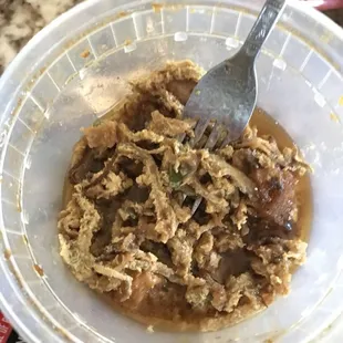 a bowl of food with a fork in it