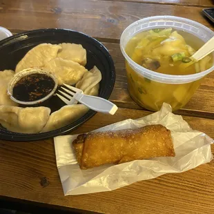 a plate of dumplings and a bowl of soup