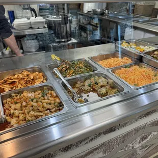 a buffet with a variety of food items