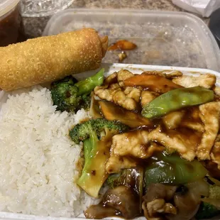 Hunan CHicken with white rice and veggie egg roll. OK