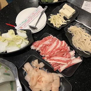 Tofu, beef, chicken, bamboo shoots, cabbage, house noodles