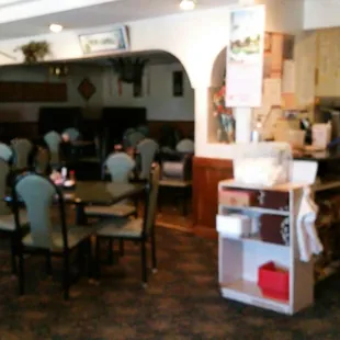 a restaurant with tables and chairs