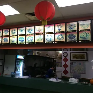 a restaurant counter with asian menus