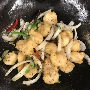 a stir fry with onions and meat