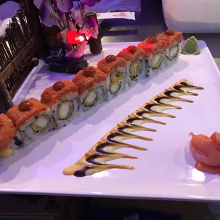 a plate of sushi and a plate of salmon