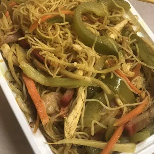 a plate of noodles and vegetables