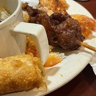 Tried the Hot and Sour Soup! Yelp, like I said, I tried it.  Chicken on a Skewer, dumplings!  The Dumplings were probably my favorite!