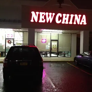 a car parked in front of a restaurant