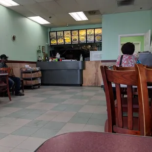 people sitting at tables in a restaurant