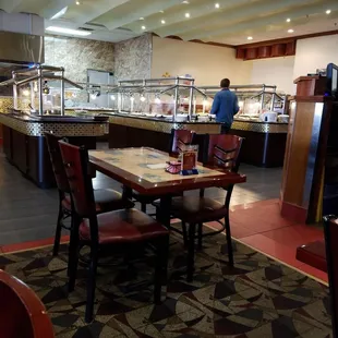 a man standing in a buffet area