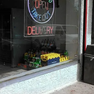 a neon sign in the window